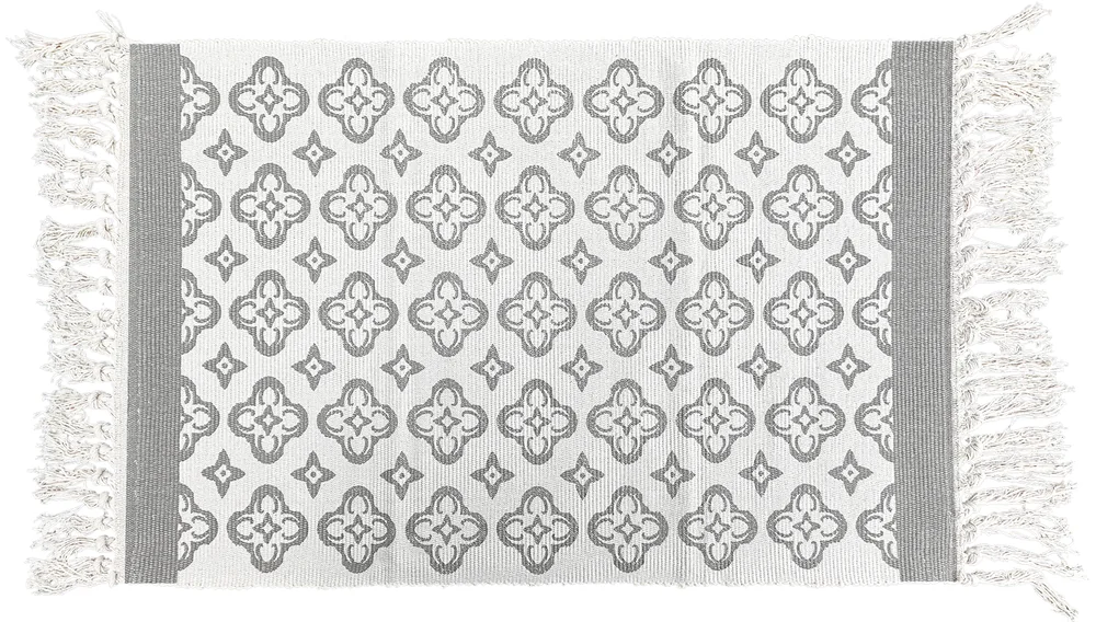 Pebble Quatrefoil layering rug, laid flat